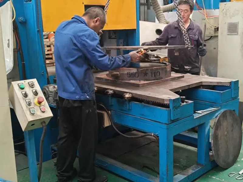 Workers operating industrial machinery.