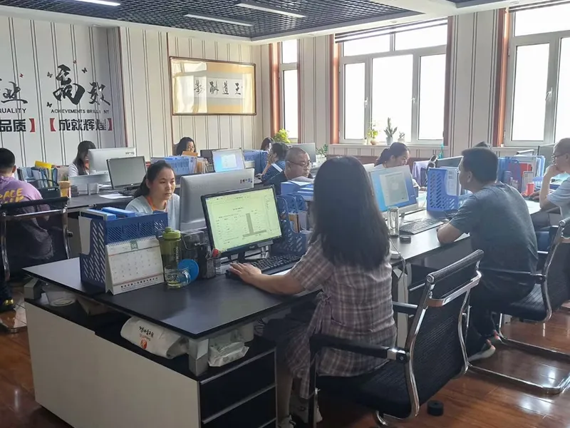 Relevant personnel working in an office environment.